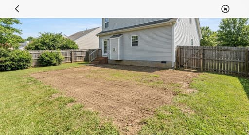 Open backyard after playset and deck were hauled away